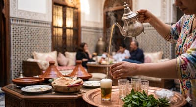 Glass of Moroccan mint tea with fresh mint